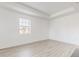 Spacious bedroom with light wood flooring and large window at 14315 Swanley St, Orlando, FL 32832