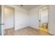 Well-lit bedroom featuring wood-look floors and an en-suite bathroom at 14315 Swanley St, Orlando, FL 32832