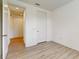 Bright bedroom with wood-look floors and access to hallway and closet at 14315 Swanley St, Orlando, FL 32832