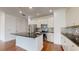 Modern kitchen with white cabinets, granite counters, and stainless steel appliances at 14315 Swanley St, Orlando, FL 32832