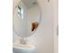 Clean bathroom with updated vanity and large circular mirror at 14315 Swanley St, Orlando, FL 32832