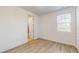 Bright bedroom with wood-look floors and access to a private bathroom at 14315 Swanley St, Orlando, FL 32832