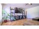 Living room with large TV and built-in shelving at 856 Bristol Forest Way, Orlando, FL 32828