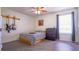 Bedroom with double bed, window, and guitar rack at 856 Bristol Forest Way, Orlando, FL 32828