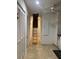 Hallway with attic access via pull-down stairs at 62 Coquina Ridge Way, Ormond Beach, FL 32174
