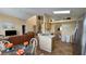 Open dining area with a view into the kitchen and living room at 3011 Bransbury Ct, Kissimmee, FL 34747