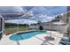 Lush backyard oasis with a kidney-shaped pool at 3011 Bransbury Ct, Kissimmee, FL 34747