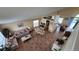 High ceilings and an open floor plan in this living room, dining area, and kitchen at 3011 Bransbury Ct, Kissimmee, FL 34747