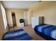 Bedroom with two twin beds, dresser and closet at 3011 Bransbury Ct, Kissimmee, FL 34747