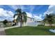 Two-story house with a white fence and palm trees in the front yard at 3011 Bransbury Ct, Kissimmee, FL 34747