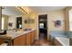 Clean bathroom with double vanity and a large bathtub at 3011 Bransbury Ct, Kissimmee, FL 34747