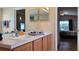 Clean bathroom with double vanity and a view into bedroom at 3011 Bransbury Ct, Kissimmee, FL 34747