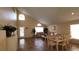 Open living area featuring tile floors, a dining area, and access to the backyard at 3011 Bransbury Ct, Kissimmee, FL 34747