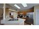 Kitchen with stainless steel refrigerator and wood cabinets at 3011 Bransbury Ct, Kissimmee, FL 34747