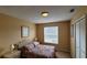 Spacious bedroom with a queen-size bed and large window at 3011 Bransbury Ct, Kissimmee, FL 34747