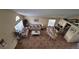 Open living room and dining area with tile floors and views into kitchen at 3011 Bransbury Ct, Kissimmee, FL 34747