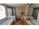 Updated bathroom with double sinks, shower, and bathtub at 3011 Bransbury Ct, Kissimmee, FL 34747
