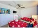 Bedroom with two twin beds and beach themed decor at 416 Orange Cosmos Blvd, Davenport, FL 33837