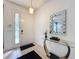 Bright entryway with a console table and a large mirror at 416 Orange Cosmos Blvd, Davenport, FL 33837