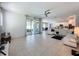 Spacious living area with tile floors and sliding glass doors at 416 Orange Cosmos Blvd, Davenport, FL 33837