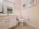 Clean bathroom with single sink vanity and toilet at 416 Orange Cosmos Blvd, Davenport, FL 33837