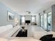 Spacious living room with white couches and large windows at 416 Orange Cosmos Blvd, Davenport, FL 33837