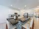Modern kitchen with white cabinets and a large island at 416 Orange Cosmos Blvd, Davenport, FL 33837
