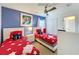 Bedroom with two twin beds and beach themed decor at 416 Orange Cosmos Blvd, Davenport, FL 33837