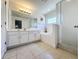 Bathroom with a bathtub, shower, and double vanity at 416 Orange Cosmos Blvd, Davenport, FL 33837