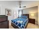 Bedroom with double bed, ensuite bathroom and ceiling fan at 416 Orange Cosmos Blvd, Davenport, FL 33837