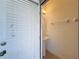 Convenient powder room with pedestal sink and white tile flooring at 416 Orange Cosmos Blvd, Davenport, FL 33837