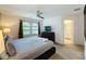 Comfortable bedroom with king-size bed and access to bathroom at 416 Orange Cosmos Blvd, Davenport, FL 33837