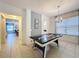 Game room with air hockey table, ideal for entertainment at 416 Orange Cosmos Blvd, Davenport, FL 33837