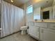 Clean bathroom with white vanity and shower/tub combo at 416 Orange Cosmos Blvd, Davenport, FL 33837
