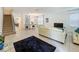 Bright living room featuring a comfortable sofa and air hockey table at 416 Orange Cosmos Blvd, Davenport, FL 33837