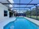 Enclosed pool area with spa and screened enclosure at 416 Orange Cosmos Blvd, Davenport, FL 33837