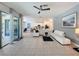 Open living space with a sectional sofa and access to a patio at 416 Orange Cosmos Blvd, Davenport, FL 33837