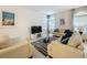 Living room with two sofas, a coffee table, and a large TV at 416 Orange Cosmos Blvd, Davenport, FL 33837