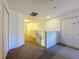 Upstairs hallway with carpet, doors to bedrooms and closets at 416 Orange Cosmos Blvd, Davenport, FL 33837