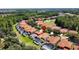 Aerial view of house and neighborhood with pools at 416 Orange Cosmos Blvd, Davenport, FL 33837