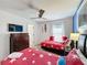 Bedroom with two twin beds and beach themed decor at 416 Orange Cosmos Blvd, Davenport, FL 33837