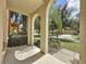 Front porch with arched columns overlooking a residential street at 416 Orange Cosmos Blvd, Davenport, FL 33837