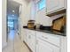 White kitchen cabinets and granite countertops with additional storage at 416 Orange Cosmos Blvd, Davenport, FL 33837