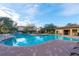 Inviting community pool with surrounding patio area at 907 Charo Pkwy # 933, Davenport, FL 33897