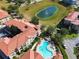 Aerial view of community pool and surrounding buildings at 907 Charo Pkwy # 933, Davenport, FL 33897