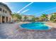 Resort-style pool with lounge chairs and patio area at 907 Charo Pkwy # 933, Davenport, FL 33897