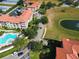 Aerial view of community, highlighting pool and building at 907 Charo Pkwy # 933, Davenport, FL 33897
