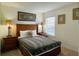 Bedroom with a full bed and neutral color scheme at 256 Sevilla Ave, Davenport, FL 33897