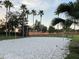 Beach volleyball court with ample sand and surrounding greenery at 256 Sevilla Ave, Davenport, FL 33897
