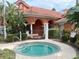 Relaxing community spa with ample seating nearby at 256 Sevilla Ave, Davenport, FL 33897